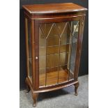 A mahogany bowfront single door display cabinet, 112cm high, 61cm wide