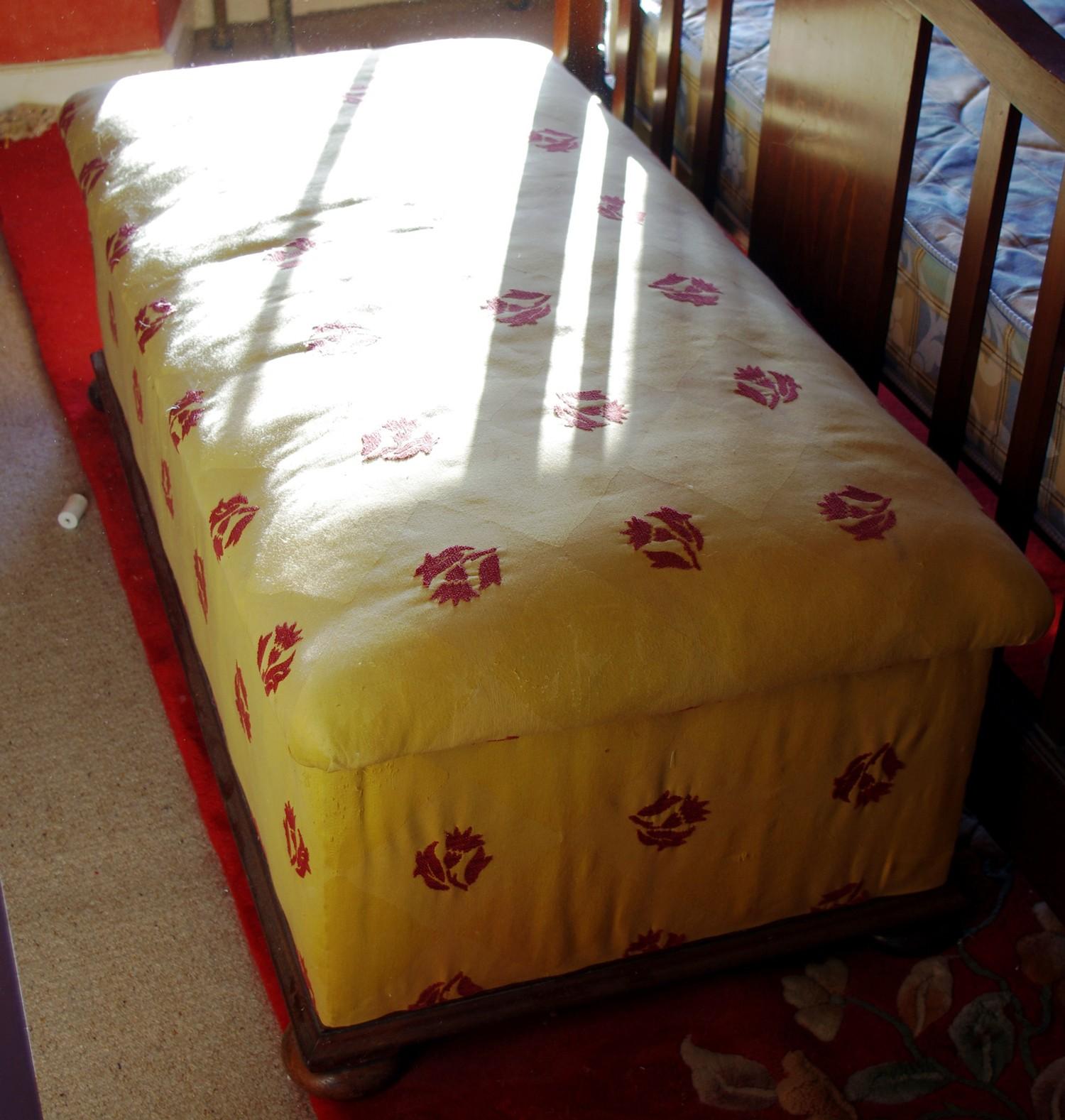 A Victorian mahogany ottoman, stuffed over top and upholstered sides, 45cm high, 125cm wide, 6 3cm