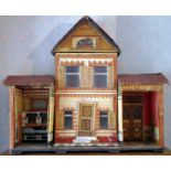 A 19th century scratch built two storey dolls house, central removal front, enclosing fitted