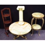 A circular veined onyx topped gilt metal coffee table, 69cm diameter; a similar two tier jardinere