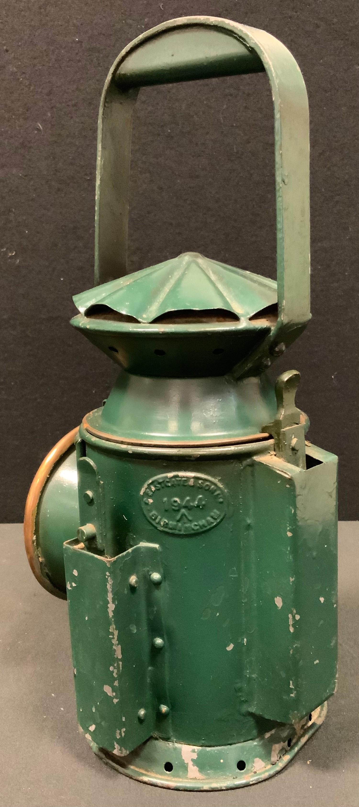 A World War II period green painted military issue Railway guardsman's lamp, by C Eastgate & Sons, - Image 2 of 3