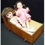 A late 19th century German bisque socket head doll, sleeping brown eyes, open mouth with two