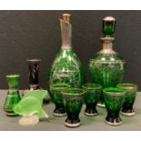 Glass - a late 19th century Venetian green glass six piece liqueur drinking set, decanter and five