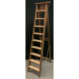 A set of vintage ten step folding wooden ladders, 206cm high