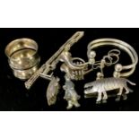 A silver napkin ring; a silver bangle; a silver L pendant; silver charms; etc