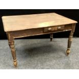 A distressed pine rounded rectangular work table, three plank top, single end and side drawers,