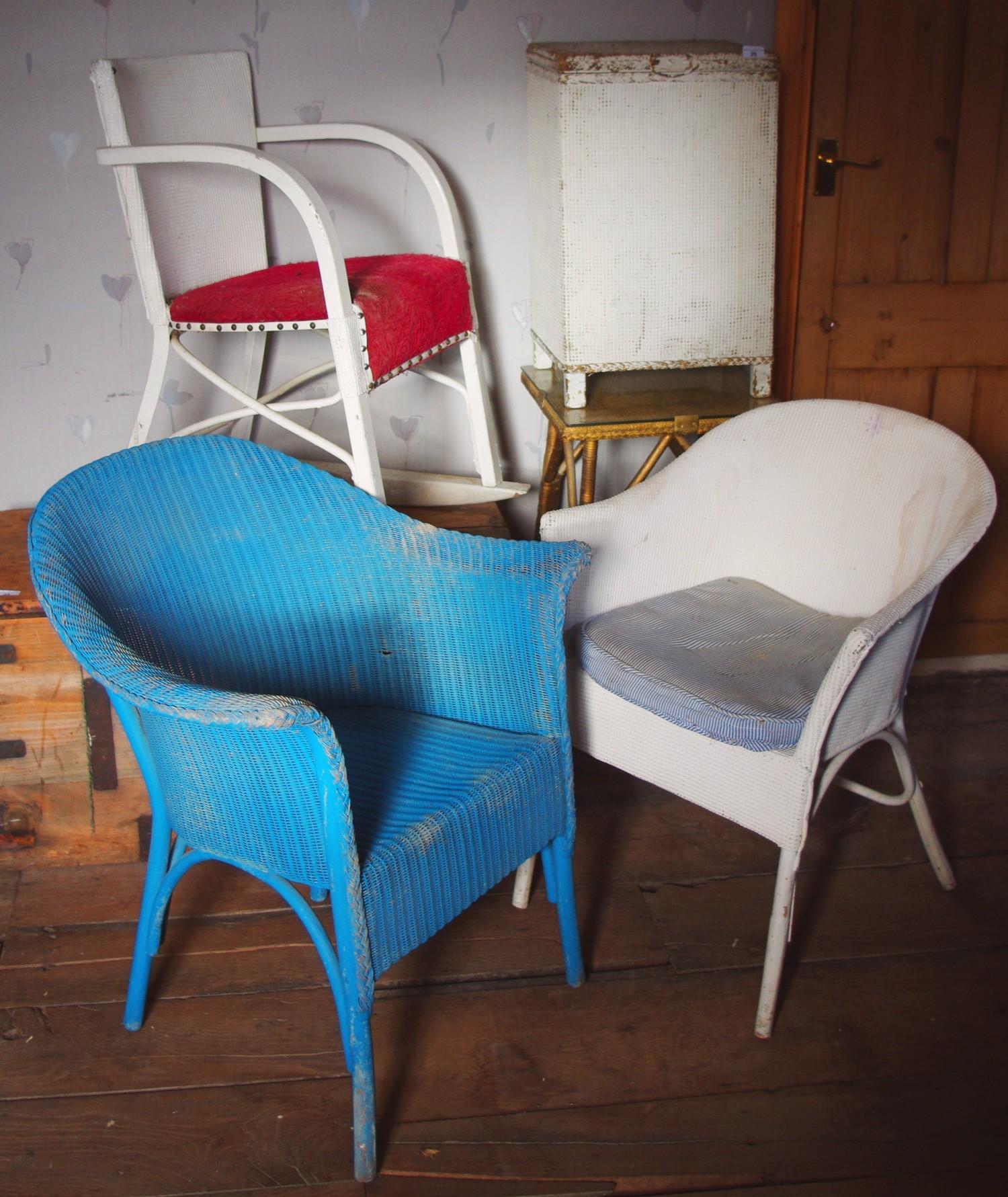 A Lloyd loom side table,; a similar linen basket; a rocker chair; two side chairs (5)