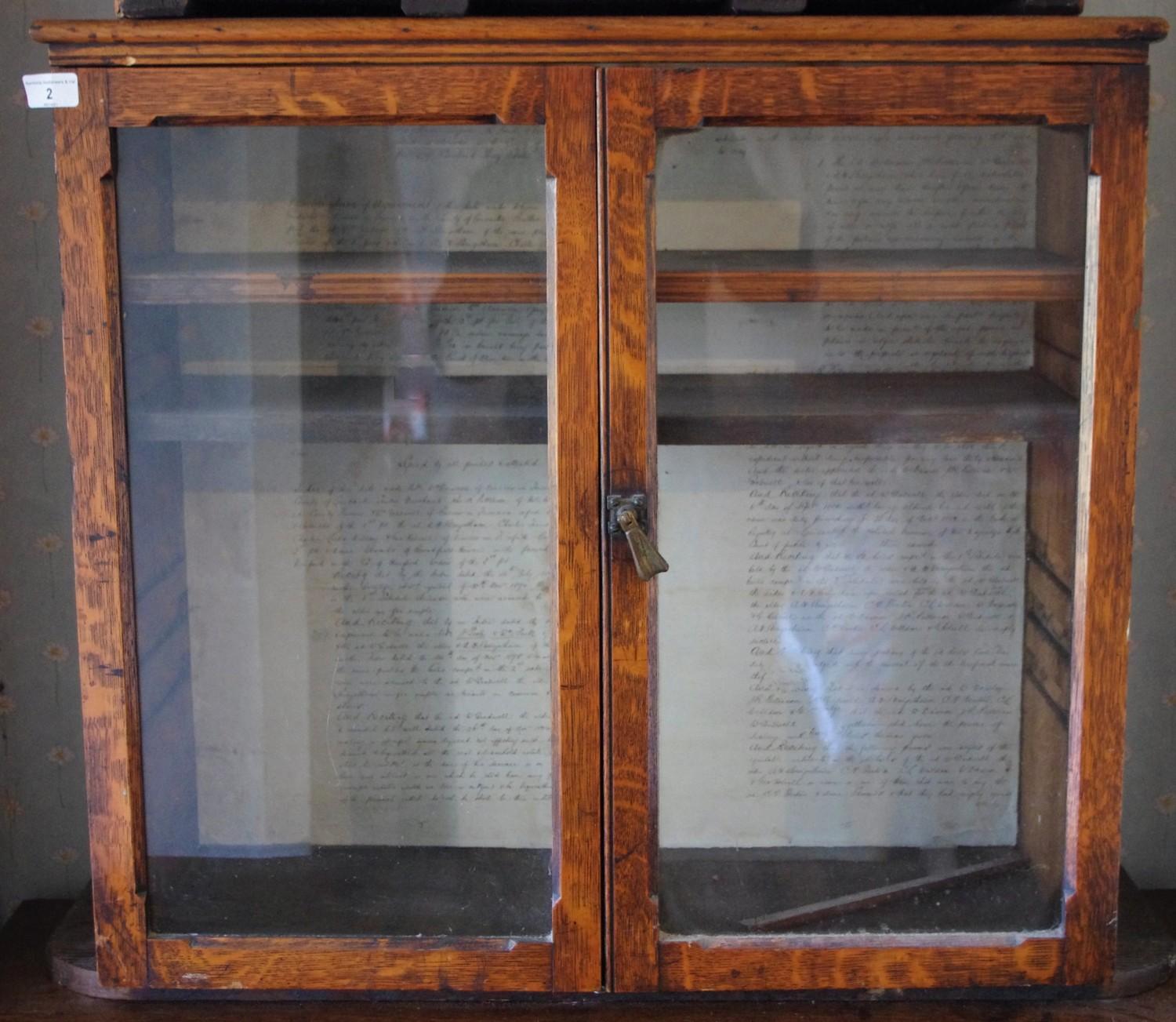 A Victorian oak two door glazed wall hanging display cabinet, two adjustable shelves, 73cm wide,