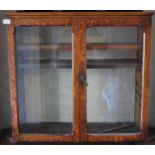 A Victorian oak two door glazed wall hanging display cabinet, two adjustable shelves, 73cm wide,