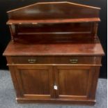 A Victorian mahogany chiffonier, shelf and turned supports to top, long drawer over two door