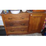 A 20th century oak kitchen cabinet, fitter with three drawers and cupboard, 137cm wide, 84cm high,