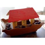 A mid 20th century wooden Noah's Arc, 39cm high, 65cm wide; a two storey dolls house, 44cm high,