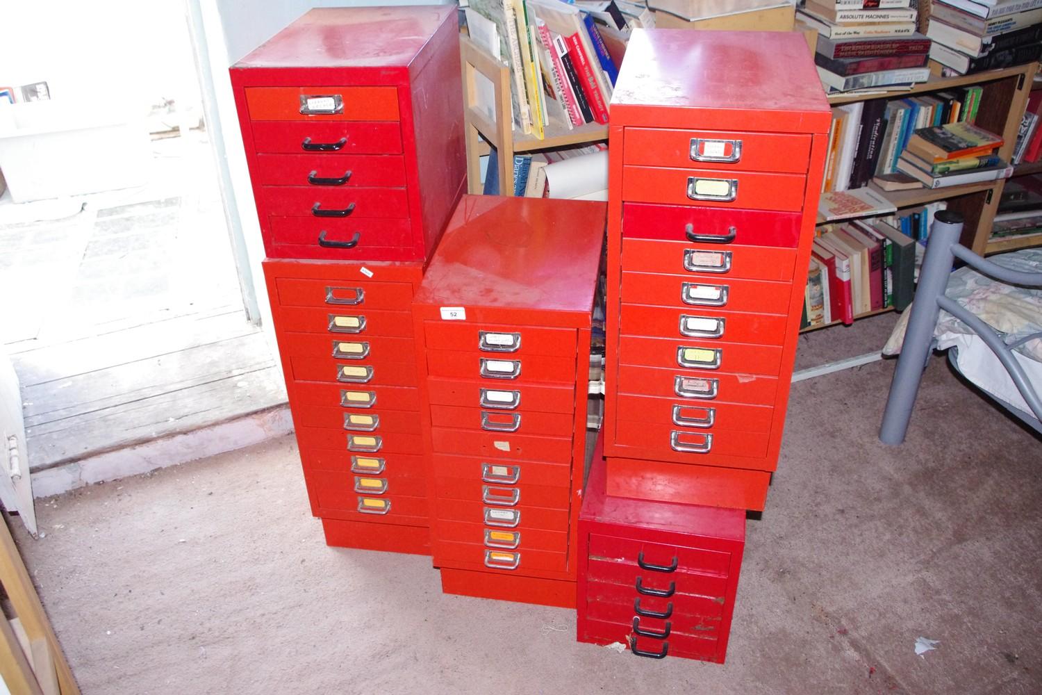 Six red metal filing cabinets, various sizes, the largest 70cm x 28cm x 41cm