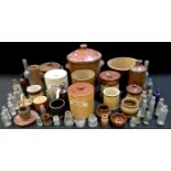 Salt glazed stoneware and glass bottles including storage jars, match striker, base etc.