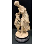 A painted spelter figure group, young maiden with pigeon. 47cm high.
