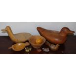 A large wooden stylised duck, 38cm long; a duck bowl, 30cm long; another; turned bowl. 16cm diam;