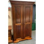 A contemporary mahogany two door wardrobe, fielded panel doors, 196.5cm high, 111.5cm wide, 64.5cm