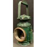 A World War II period green painted military issue Railway guardsman's lamp, by C Eastgate & Sons,