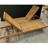 A pair of slatted wooden sun loungers, adjustable top section, 195cm long, 55cm wide