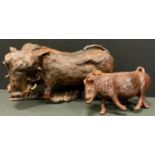 A carved wooden figure Wild Boar standing, 20cm high, 43cm long; another Hoglet, smaller (2)