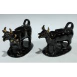 A pair of Jackfield cow creamers (2)