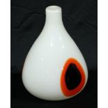 A Murano glass vase, decorated with black and orange oval shapes on a white ground, in the style