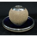 A silver mounted Royal Doulton table vesta, the dished base centred by a globular match striker,