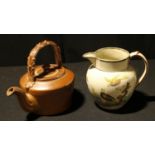 A Georgian lustre rimmed jug, decorated with birds amongst foliage; a salt glazed teapot (2)