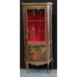 A Louis XV style gilt metal mounted mahogany shaped serpentine vitrine, pierced gallery above a