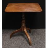 A George III tilt top occasional table, rounded rectangular top, turned column, downswept reeded