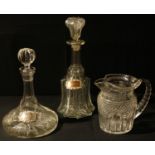 A George III Irish cut glass jug; a cut glass decanter with port label; a Victorian decanter with