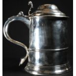 A George II silver cylindrical tankard, hinged domed cover with scroll thumbpiece, S-scroll