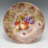 A Royal Worcester circular plate, painted by Smith, signed, with ripe fruit on a mossy bank, 23cm