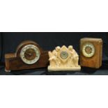An Art Deco plaster clock, Happy Hours, 27cm wide; a Westmister chime mantel clock; another mantel