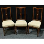 A set of three Sheraton Revival design side chairs, each pierced rectangular splat centred by an