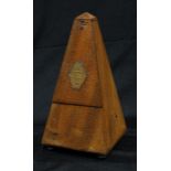 A late 19th century French walnut metronome, c.1900
