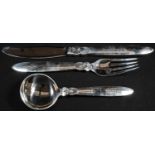 Georg Jensen - a Danish silver Cactus [Kaktus] pattern knife, fork and spoon, designed by Gundorph