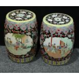 A pair of Chinese Famille Rose barrel shaped garden seats, 46cm and 48cm respectively