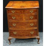 A Queen Anne style walnut chest of drawers, bow-front top above four cockbeaded graduated drawers,