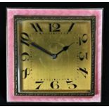 An early 20th century silver coloured metal and pink guilloche enamel easel boudoir timepiece, 6cm