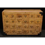 A contemporary pine chest of drawers/collectors cabinet, flush rectangular top above an