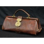 A brown leather Gladstone bag, of small proportions, with key, 38cm wide