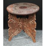 A small circular wine table, carved with fruiting vine, tripod base,45cm diameter, 46cm high