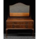 A Queen Anne style mahogany dressing table, bevelled arched looking glass above a rectangular top,