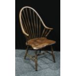 A spindle back kitchen chair, saddle seat, turned supports, 104cm high