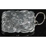 An early Victorian silver shaped rectangular miniature vinaigrette, bright-cut engraved with