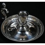 A Victorian silver chamber stick, half-fluted campana sconce, figural S-scroll handle, domed base
