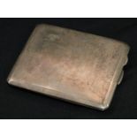 Military Interest - a George V silver shaped rectangular cigarette case, the interior with a