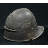 A Medieval Revival French steel helmet, hinged visor, 38cm long
