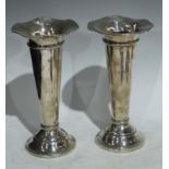 A pair of silver trumpet shaped posy vases, Birmingham 1908, hollow filled, 21cm